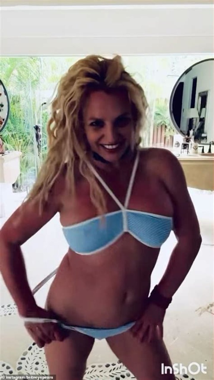Britney Spears Rolls Around The Ocean In Just Her Bikini Bottoms In New Honeymoon Video