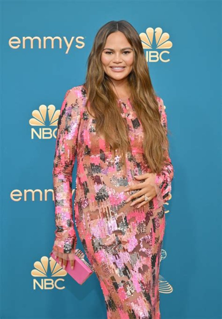 Chrissy Teigen Channels Barbie In Pink Dress With Slit For Date Night With John Legend: Photos