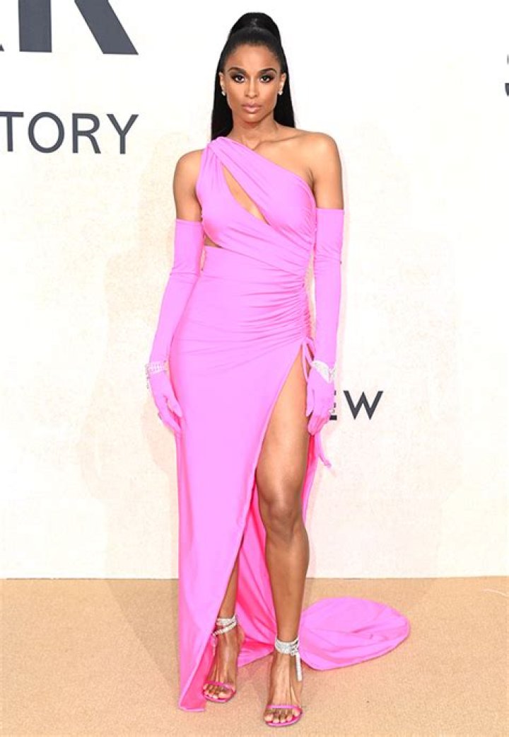 Ciara Slays In Neon Pink High Slit Gown At Cannes amfAR Gala: Photos