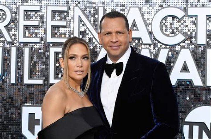 Jennifer Lopez & Alex Rodriguez Rock Matching PJs & Share Sweet Kiss In Front Of Their Christmas Tree