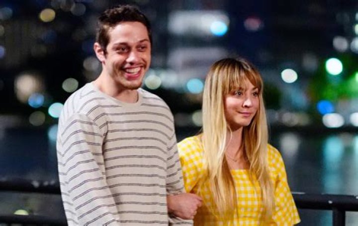 Kaley Cuoco Cradles Pete Davidson’s Face In Sweet Photos From Their Movie ‘Meet Cute’