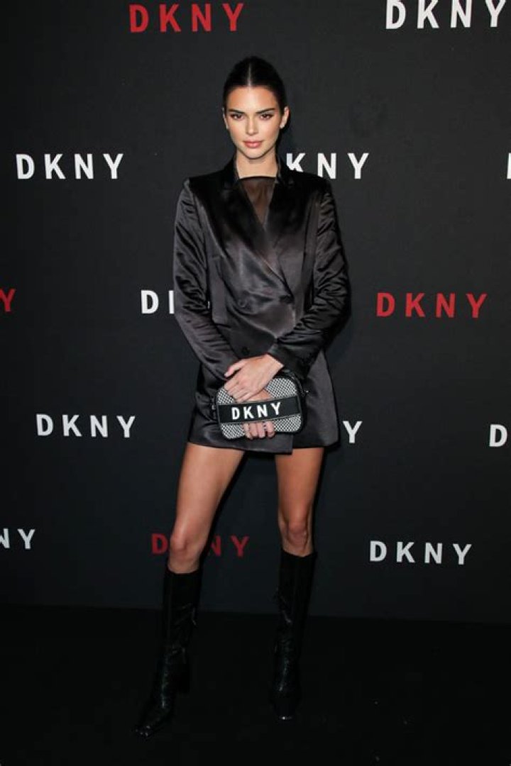 Kendall Jenner Stuns In Sexy Black Satin Jacket & Knee-High Boots At The DKNY 30th B-Day Party