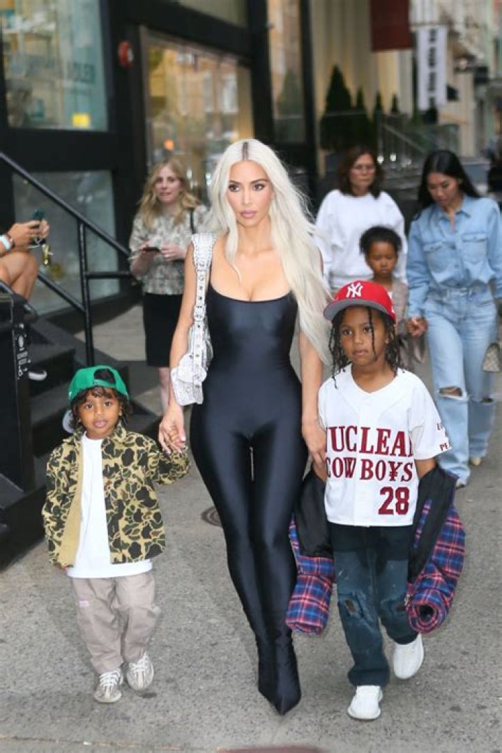 Kim Kardashian Rocks Sexy Bodysuit Outside Her Hotel With Sons Saint & Psalm: Photos