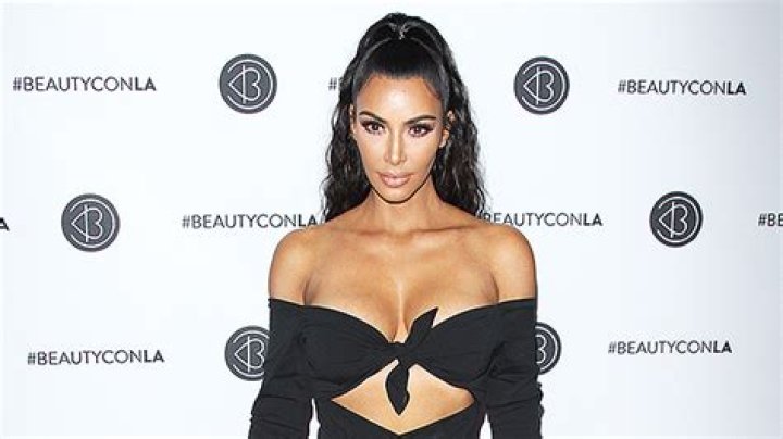 Kim Kardashian Goes Braless Showing Off Major Cleavage In Sexy Tied Up Shirt — See Pic
