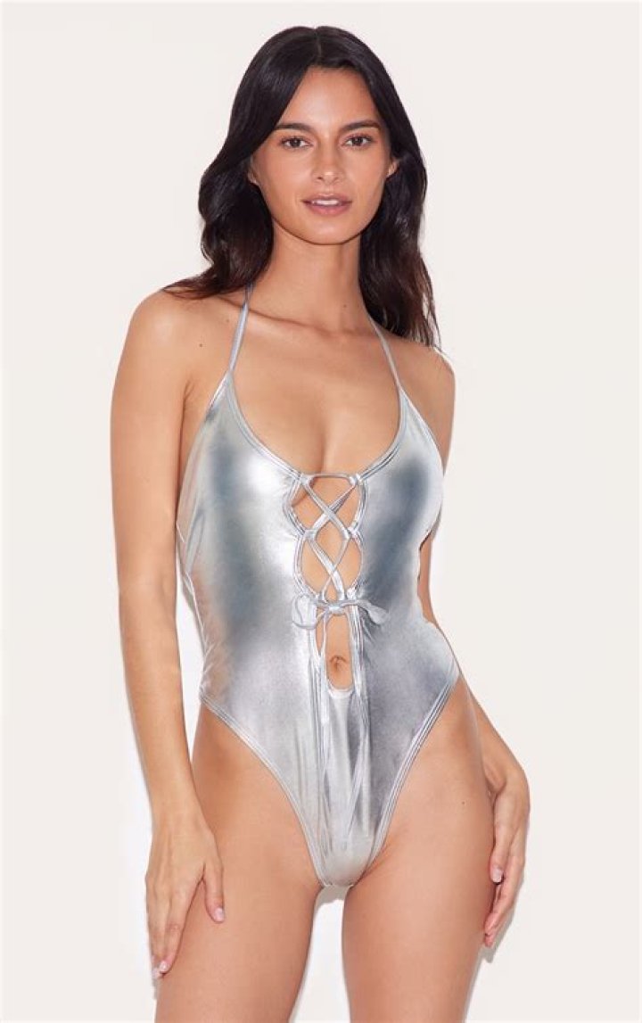 Kylie Jenner Lounges By The Pool In Sexy Metallic Silver Swimsuit – See Pic