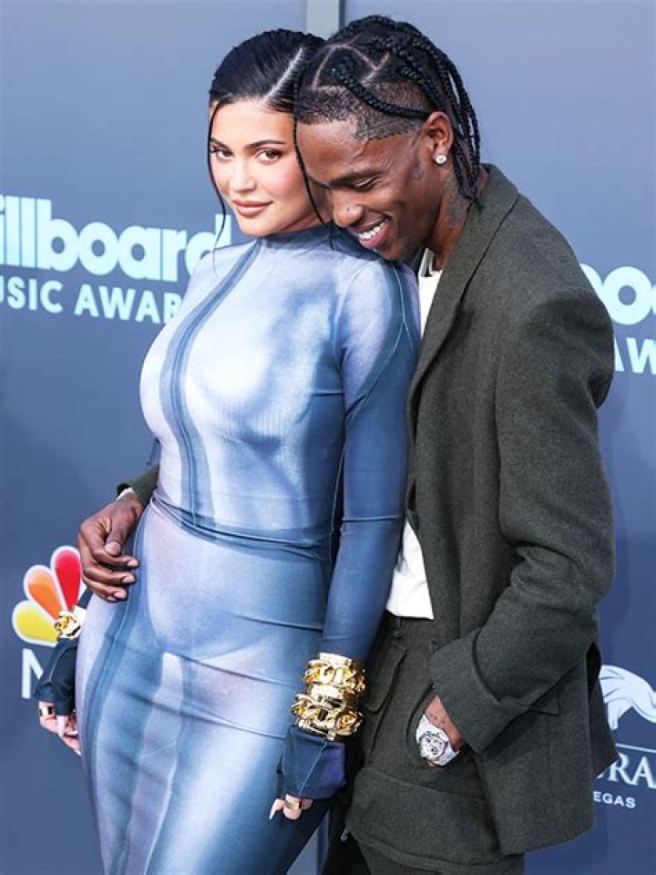 Kylie Jenner & Travis Scott Cuddle On A Lounge Chair In Her New TikTok: Watch